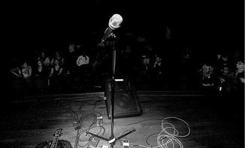 A microphone alone on stage